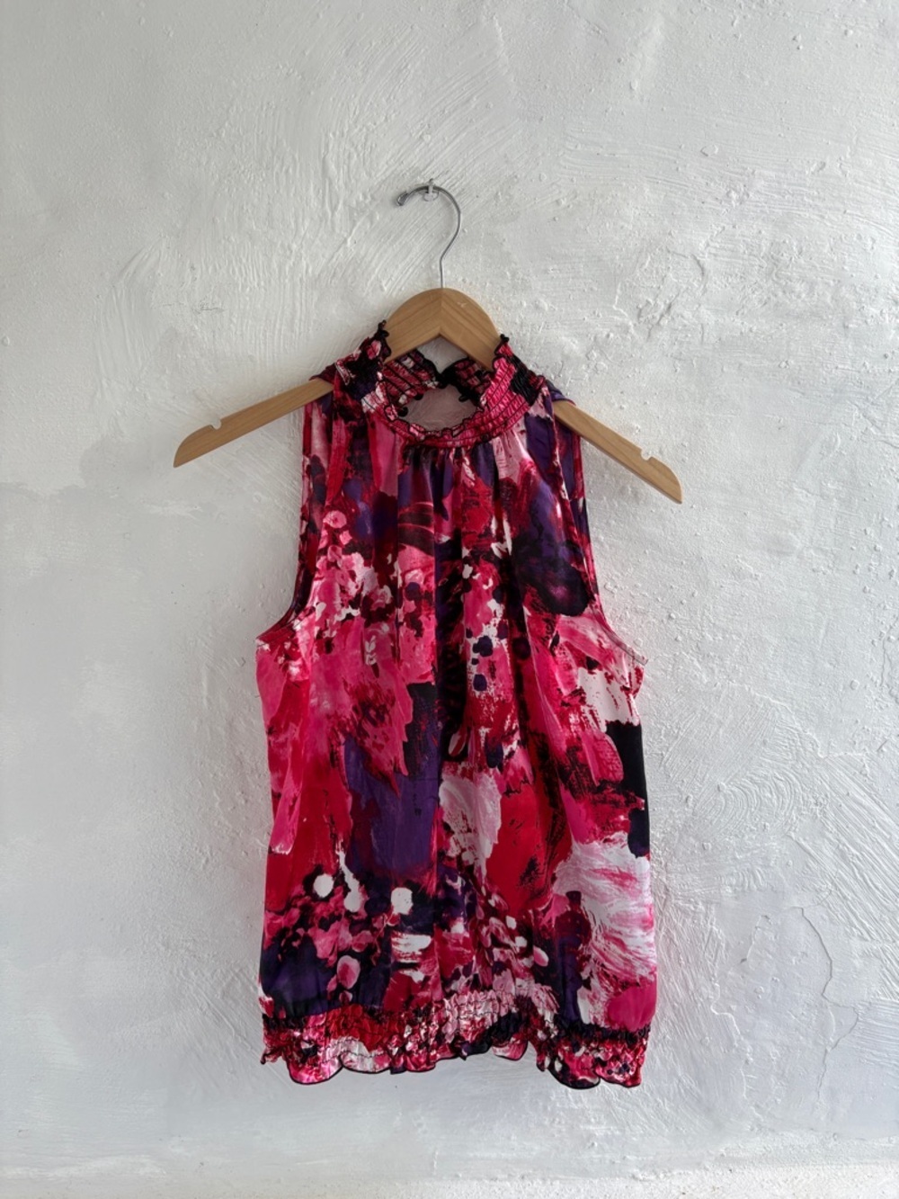 A Byers mock neck styled sleeveless blouse